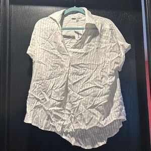 Time slipped away off white top